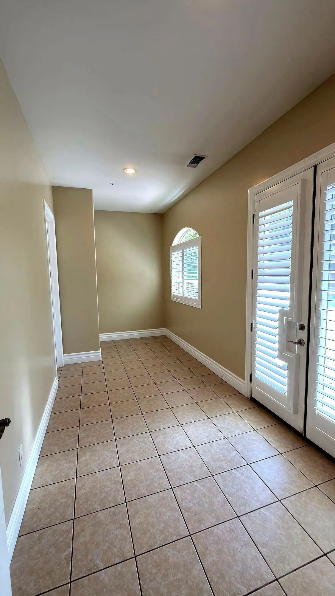 Doors, casing and base carried through a hallway.