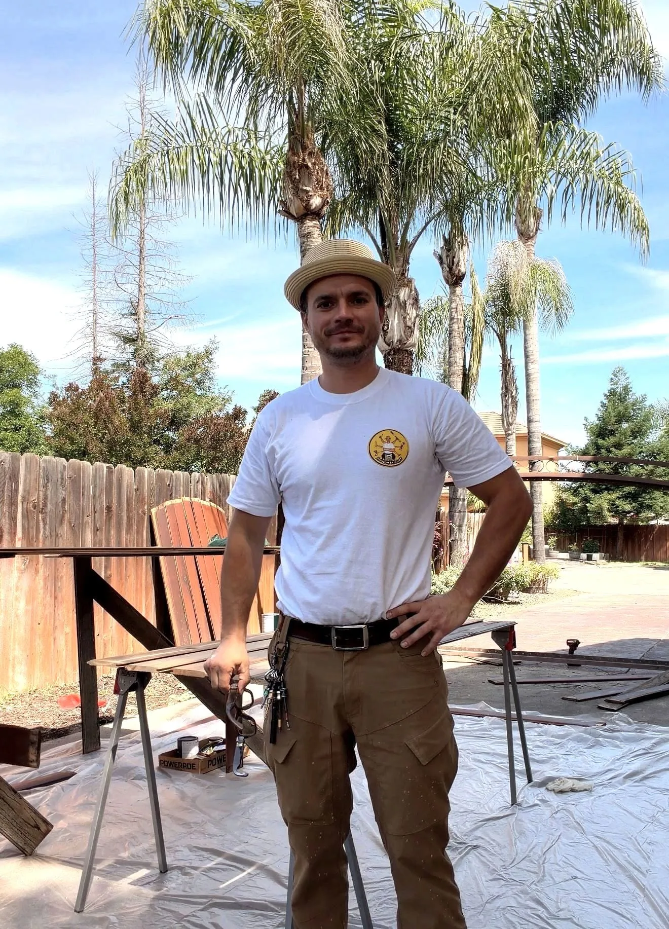 Serj on a Sacramento job in his hat and branded shirt